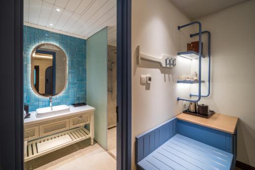 a bathroom with a sink and a mirror at Centara Mirage Resort Mui Ne in Mui Ne