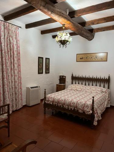 מיטה או מיטות בחדר ב-Casa rural luciano