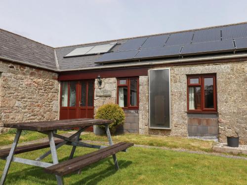 a house with solar panels on the roof at Kestrel Corner in Lanivet