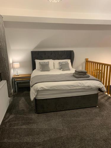 Ένα ή περισσότερα κρεβάτια σε δωμάτιο στο Minneymoor lodge