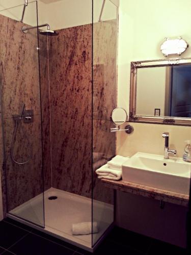 a bathroom with a shower and a sink at Hotel Paul Otto in Görlitz