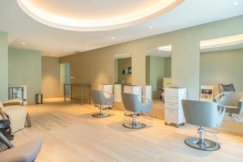 a salon with three chairs in a room at St Martin Beach Resort & Spa in Anse Marcel 