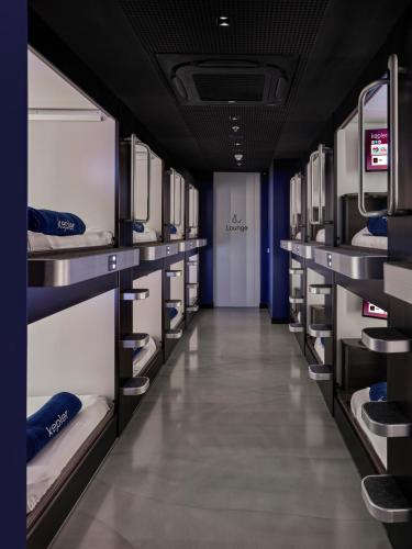a row of bunk beds in a room at Kepler Club Sabiha Gökçen Airport - International Transit Area in Istanbul
