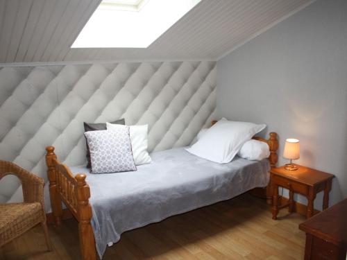 a bedroom with a large bed with a large window at Gîte Belleville-sur-Meuse, 4 pièces, 4 personnes - FR-1-585-42 in Belleville-sur-Meuse