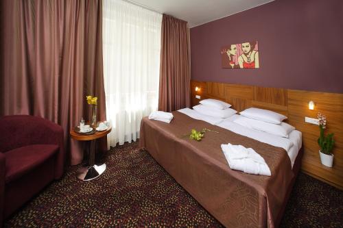 Een bed of bedden in een kamer bij 1.Republic Hotel