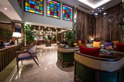 a lobby with a bar with stained glass windows at Au Lac Legend Hotel in Ho Chi Minh City