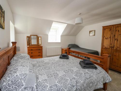 Posteľ alebo postele v izbe v ubytovaní Storkery Cottage