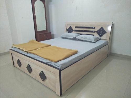 En eller flere senger på et rom på Swami Home Stay