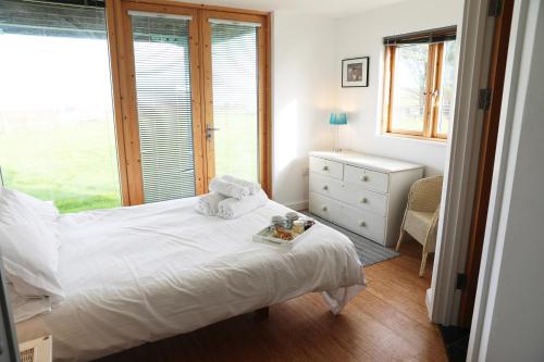 Northlight, Port Isaac Bay Holidaysにあるベッド