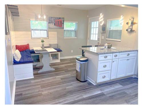 a kitchen with a counter and a sink and a desk at Lovely 3BR 3BA Home minutes from Airport/Downtown Atlanta in Atlanta