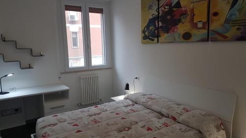 Кровать или кровати в номере Appartamento appena ristrutturato