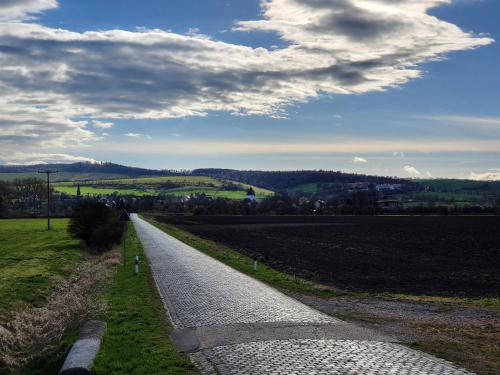 a road in the middle of a field at Ferienhaus Triasland in Donndorf
