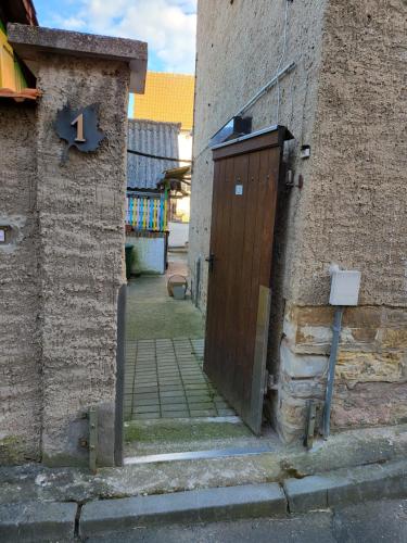 a brick building with a door on the side of it at Ferienhaus Triasland in Donndorf
