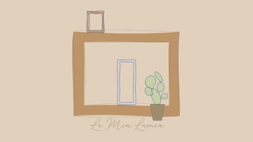 a picture of a window with a plant in a vase at La Mia Lamia in Cisternino