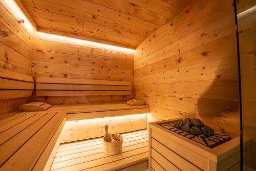 a wooden sauna with a bench in the middle at Chalet Königsleiten 148 in Königsleiten