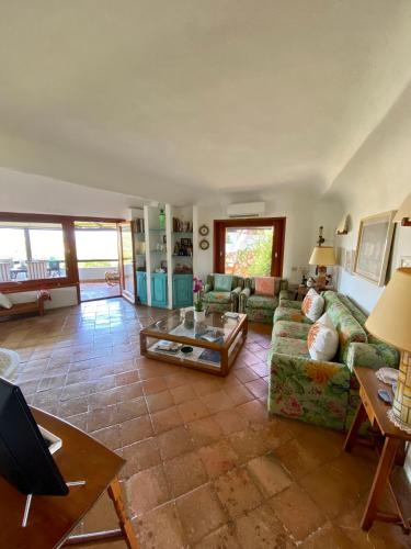 a living room with a couch and a table at Seaview Apartment in Porto Cervo in Porto Cervo