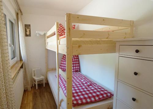 a bedroom with two bunk beds in a room at Kandel - Stubenhof, Black Forest in Simonswald