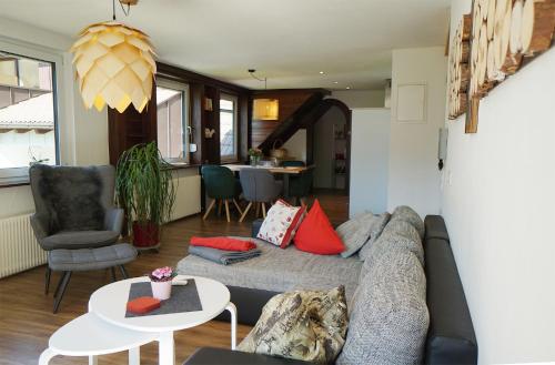 a living room with a couch and a table at Kandel - Stubenhof, Black Forest in Simonswald