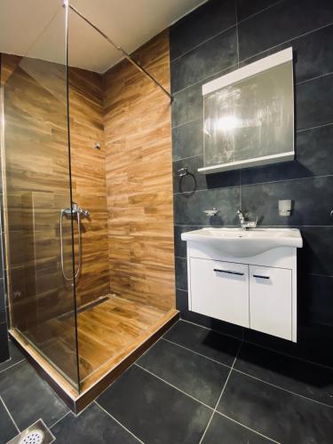 a bathroom with a shower and a sink at Villa Blanca in Risan