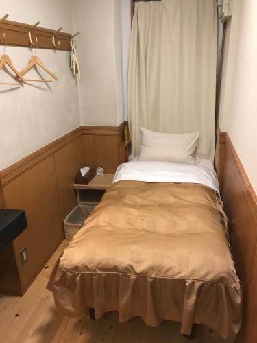 Ένα ή περισσότερα κρεβάτια σε δωμάτιο στο Business Hotel Crescent