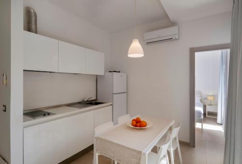 Kuchyň nebo kuchyňský kout v ubytování Salento Residence & Suite