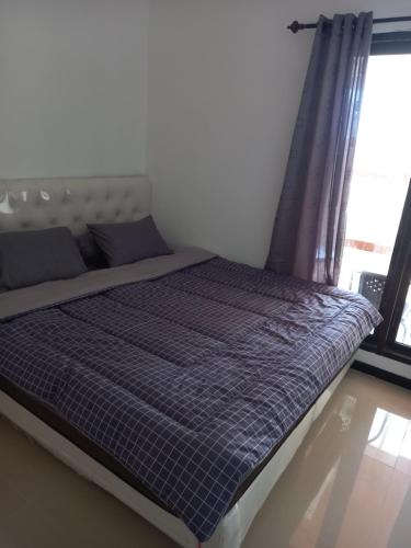 Postel nebo postele na pokoji v ubytování ARDMORE A10 HOMESTAY MALANG