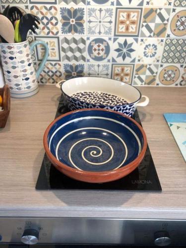a bowl is sitting on a plate on a counter at The Thin Seagull 4 Beacon Terrace Ferryden in Ferryden