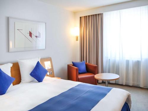 Cama o camas de una habitación en Novotel Andorra