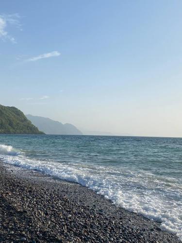a rocky beach with the ocean in the background at European Village Old Villa 6 in Gonio