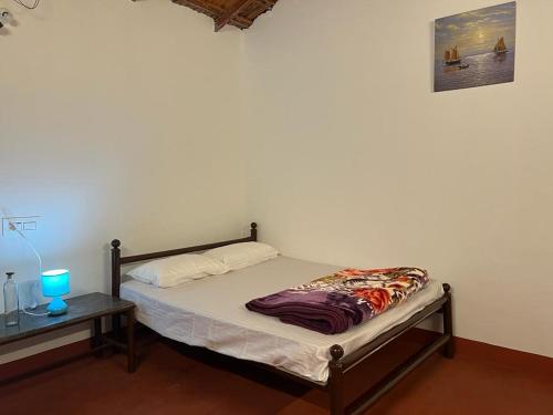 Voodi või voodid majutusasutuse Darshan's Home Stay toas