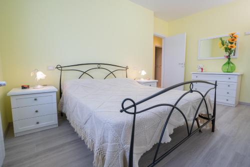 En eller flere senge i et værelse på Casa Gli Ulivi