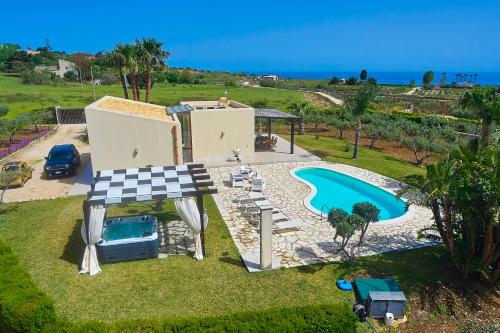 an aerial view of a villa with a swimming pool at Villa delle Stelle in Scopello
