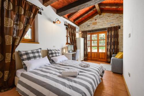 a bedroom with a large bed in a room at Villa Elaya in Bašići