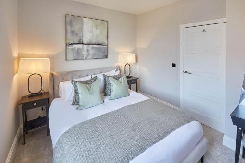 Tempat tidur dalam kamar di Host & Stay - Ocean Pearl