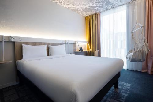 Cama o camas de una habitación en ibis Almaty Jetisu