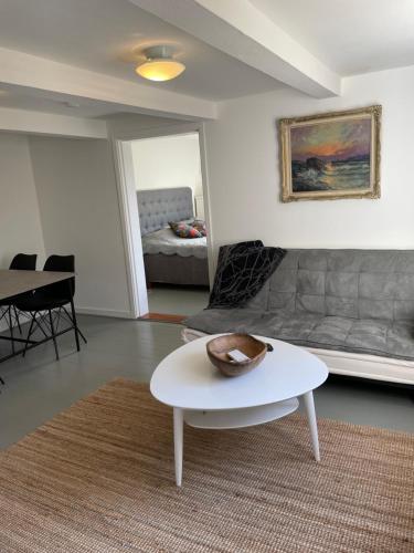 a living room with a couch and a coffee table at Grindhuset in Skottorp
