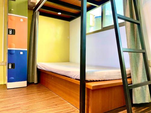 澎湖北吉光背包客民宿 Bayhouse Hostel Penghuにあるベッド