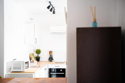 Η κουζίνα ή μικρή κουζίνα στο Apartamentos la Encarnación