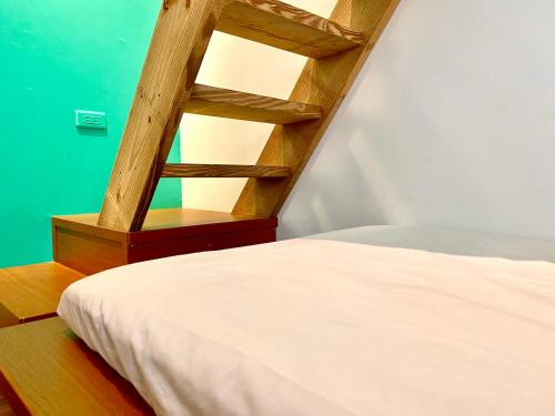 澎湖北吉光背包客民宿 Bayhouse Hostel Penghuにあるベッド