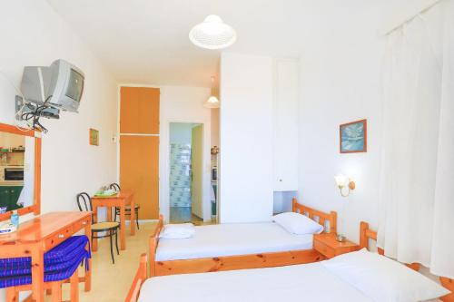 Ένα ή περισσότερα κρεβάτια σε δωμάτιο στο Vista Mare Faros