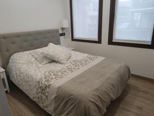 A bed or beds in a room at Apto. Completo, La Ribera