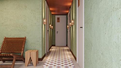 a hallway with a bench and a chair at EcoCharme Pousada Varandinha in Fernando de Noronha