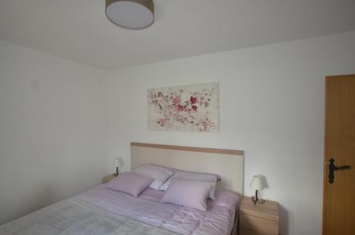 En eller flere senge i et værelse på Kuća za odmor Gacka