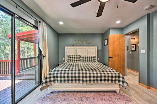 a bedroom with a bed and a balcony at Cabin in Tonto National Forest Deck and Views! in Pine