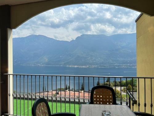 a view of a lake from a balcony at Village Bazzanega - Montagnoli Group in Tremosine Sul Garda