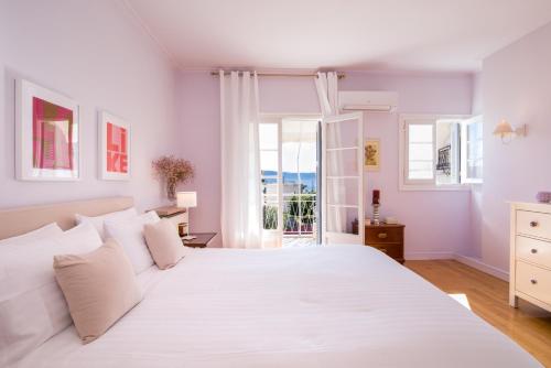 מיטה או מיטות בחדר ב-Corfu town tranquility gem