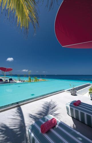 a swimming pool with a view of the ocean at OBLU SELECT Lobigili - Premium All-Inclusive with Free Transfers in Male City