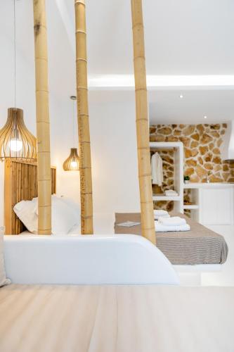 a view of a bedroom with a bed in a room at Krina Mare Boutique Hotel in Naxos Chora
