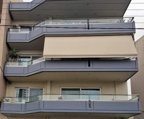 a building with balconies on the side of it at Urbanity - The Cretan Urban Experience in Heraklio