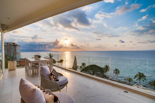 a balcony with a view of the ocean at Maxwell Residences at Indah in Puerto Vallarta